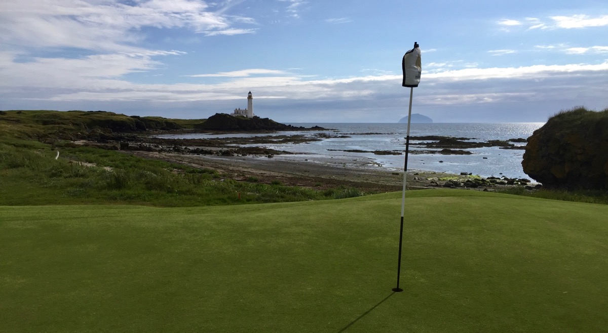TurnberryResort 10th green with lighthouse Ailsa Craig in background